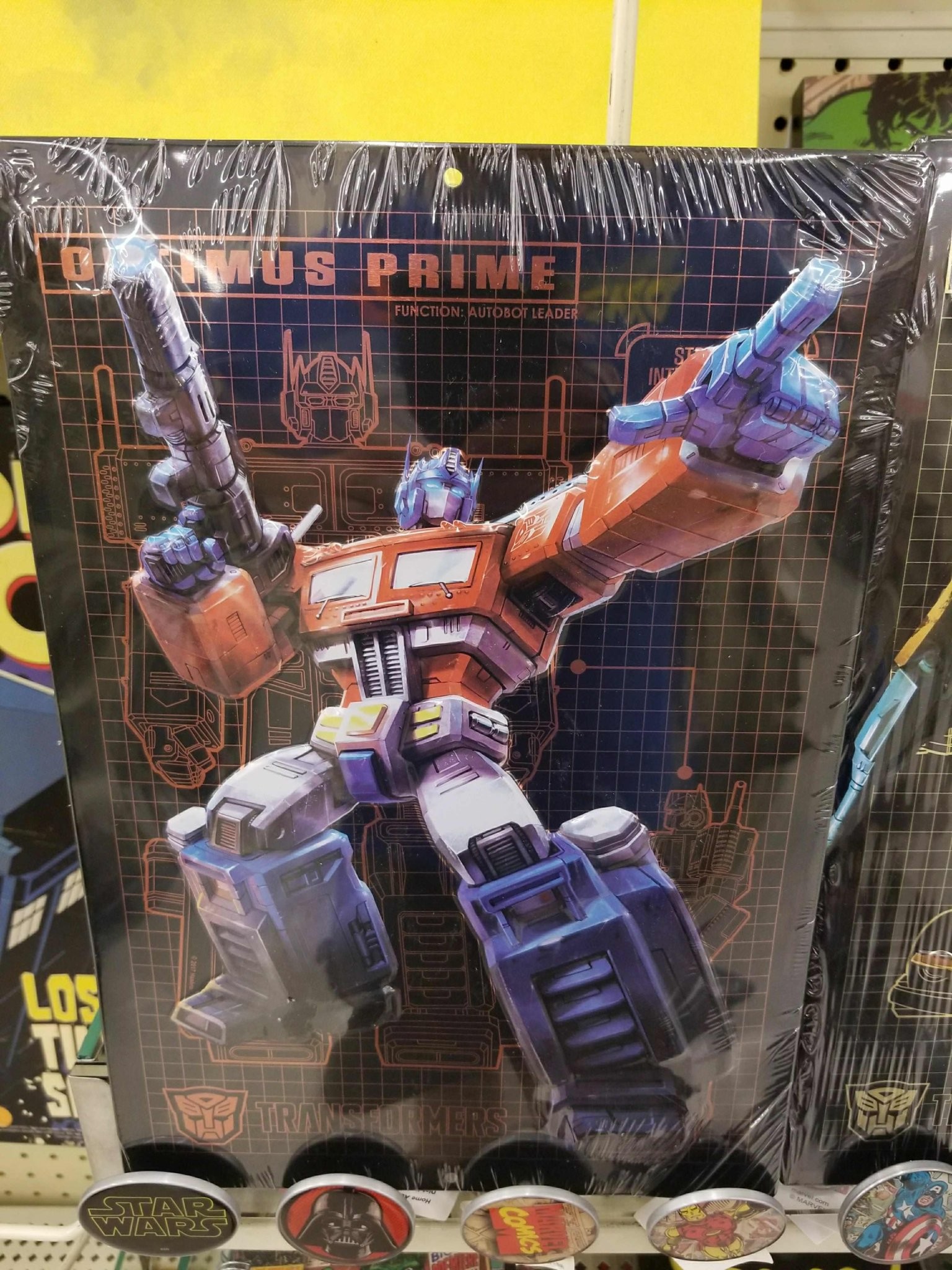 Transformers News: Transformers Embossed Tin Signs found at Hobby Lobby