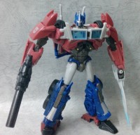 Transformers News: Transformers Prime Voyager Optimus Prime In-Hand with Comparison to Deluxe