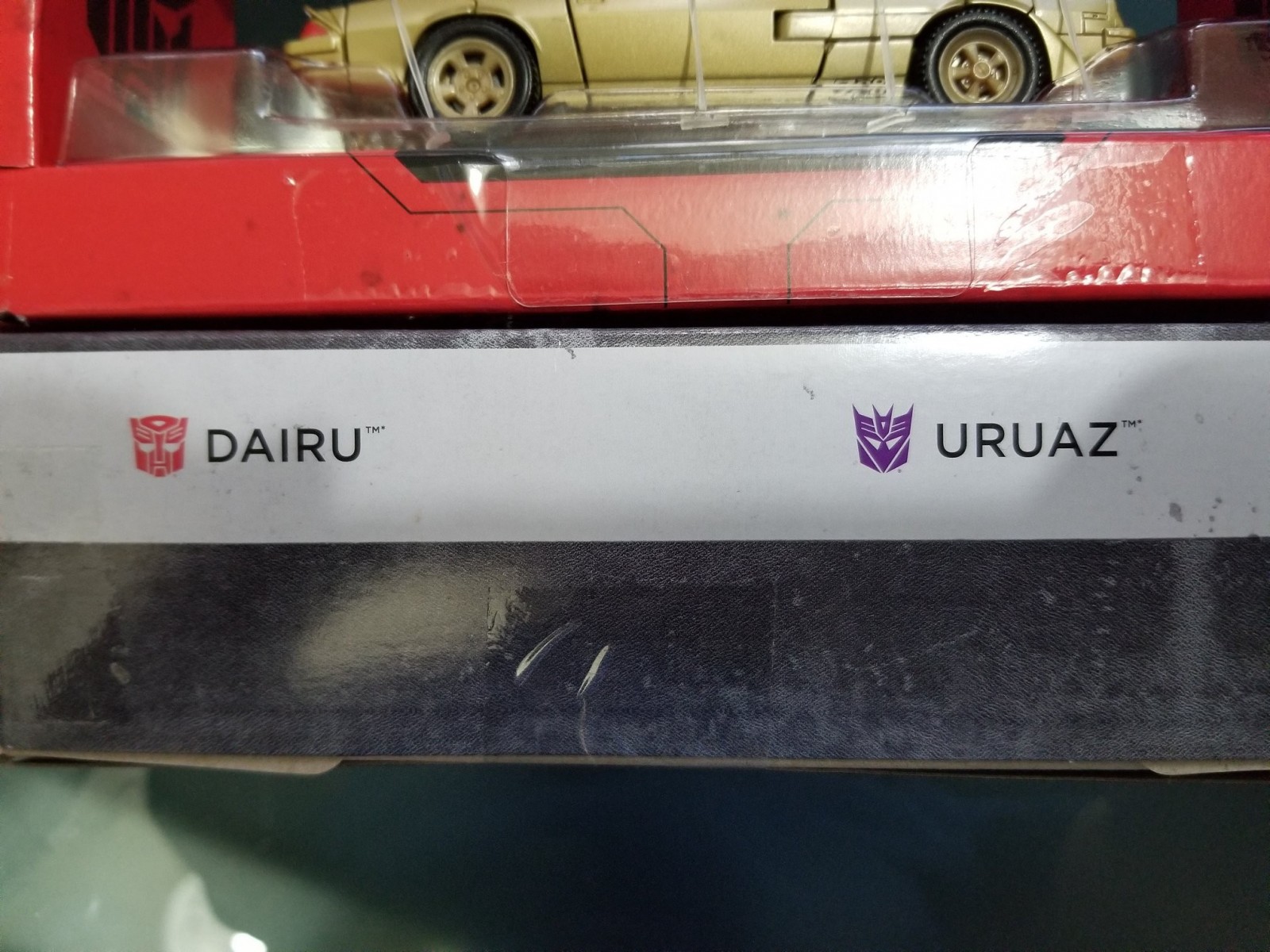 Transformers News: In-Hand Images of #HasbroSDCC Exclusive Dairu & Uruaz Dino Cassettes